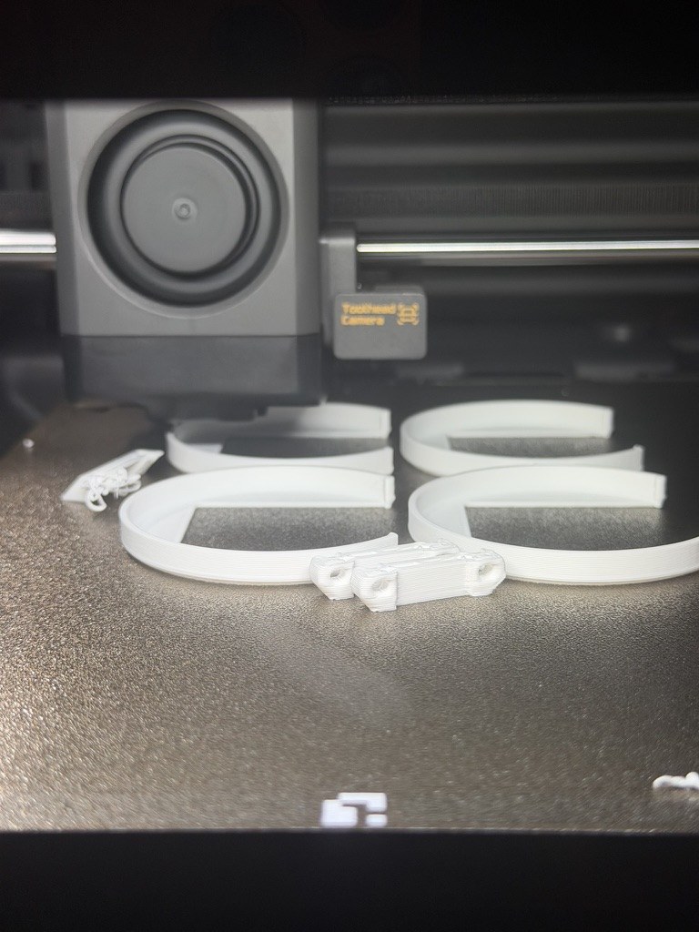 White printed parts on the printer bed